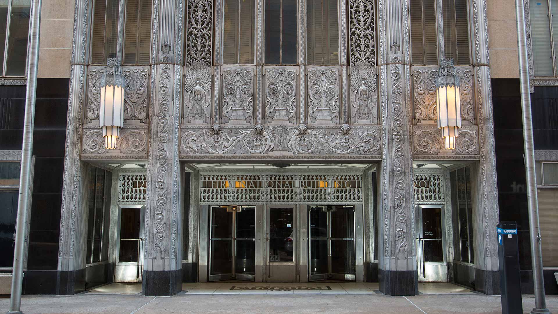 the entrance to a building with ornate carvings at The  First