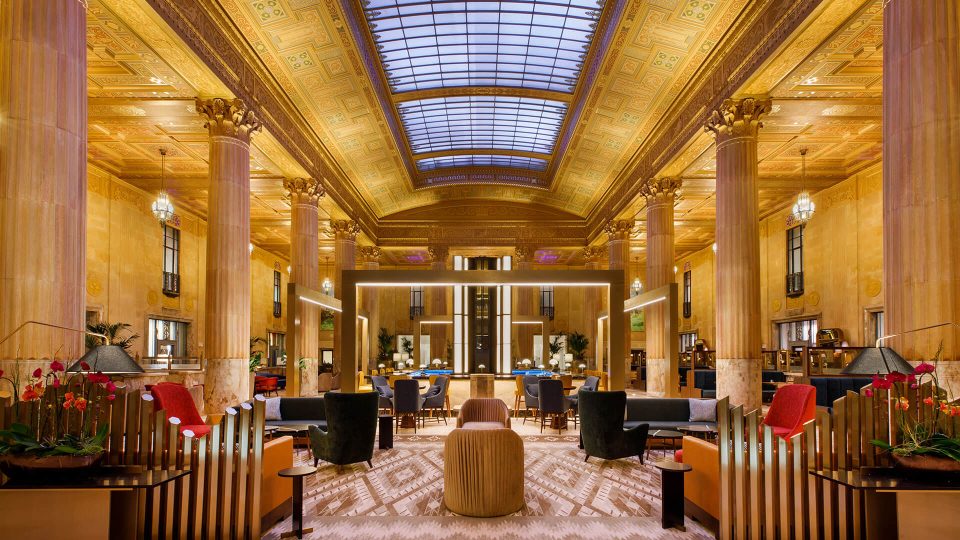 the lobby of a hotel with a large skylight at The  First