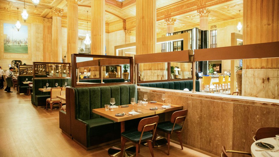 a restaurant with wooden tables and benches at The  First