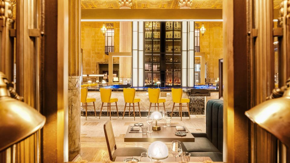 the interior of a restaurant with a large dining area at The  First